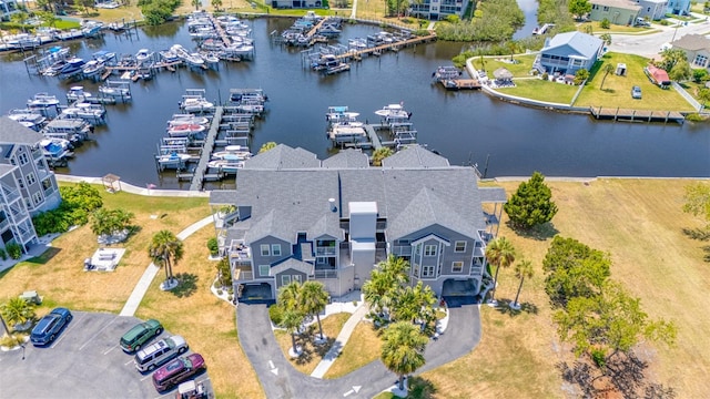 birds eye view of property with a water view