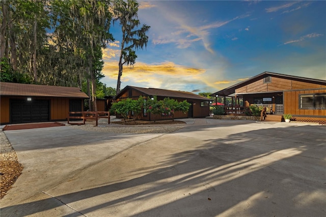 exterior space featuring a garage and an outdoor structure