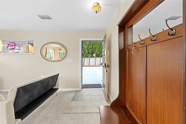 mudroom featuring light colored carpet