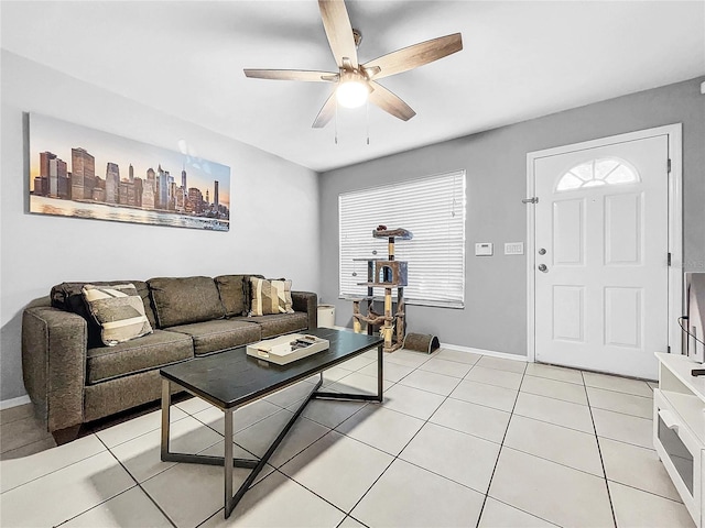 living room featuring light tile patterned floors and ceiling fan