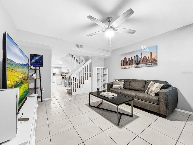 tiled living room featuring ceiling fan