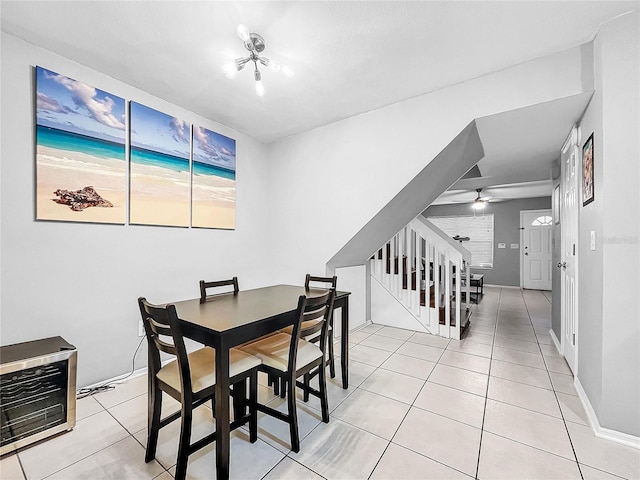 tiled dining space featuring ceiling fan and heating unit