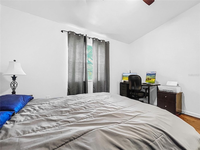 bedroom with hardwood / wood-style flooring