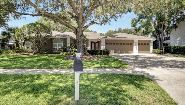 ranch-style house with a garage and a front lawn