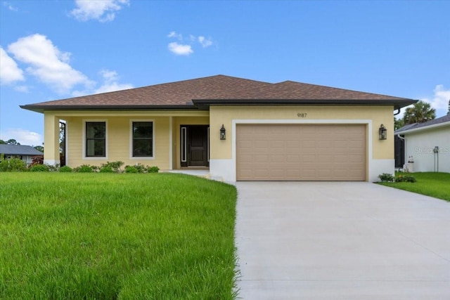 view of front facade featuring a garage and a front lawn