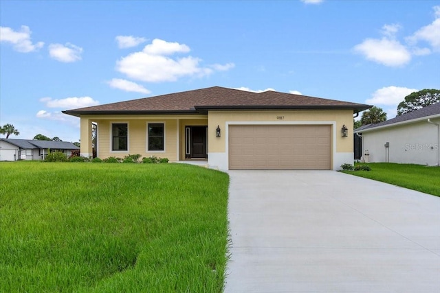 view of front facade with a garage and a front lawn