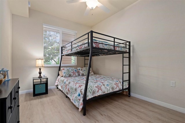 bedroom featuring hardwood / wood-style flooring and ceiling fan