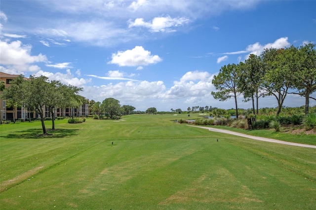 view of property's community featuring a lawn