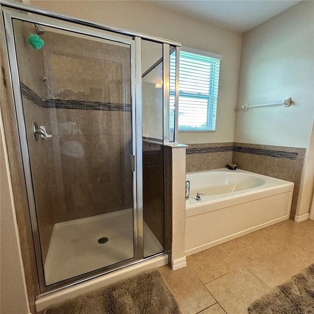 bathroom featuring tile patterned floors and plus walk in shower