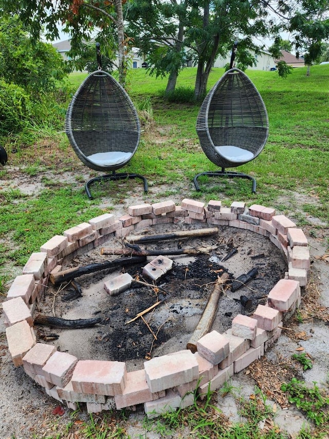 view of yard with an outdoor fire pit