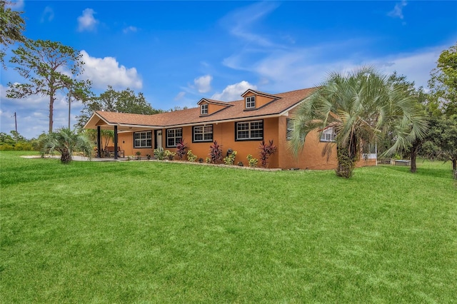 view of front of home with a front yard