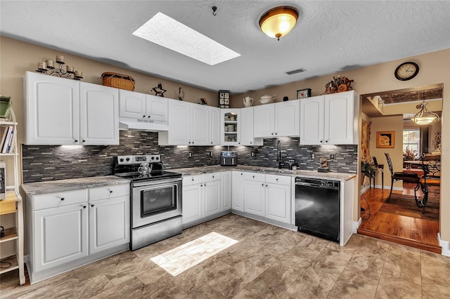 kitchen with dishwasher, a skylight, white cabinetry, and stainless steel electric stove