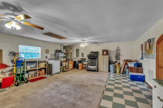 garage featuring electric panel and washer / clothes dryer