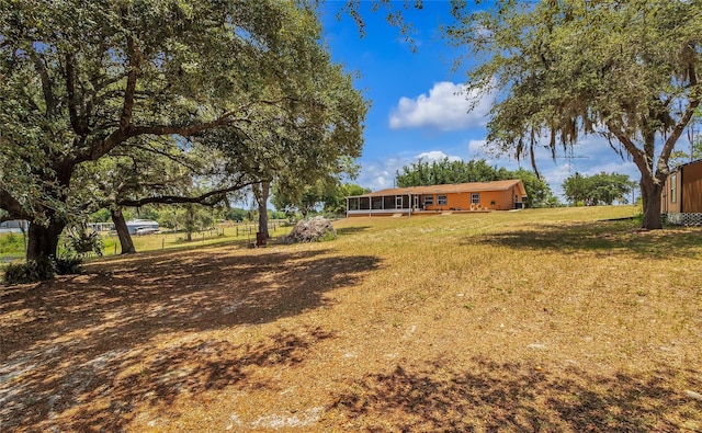 view of yard with a sunroom