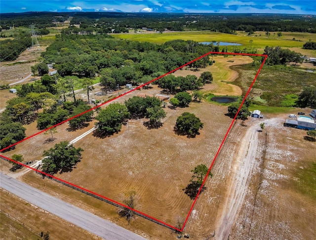 birds eye view of property with a rural view