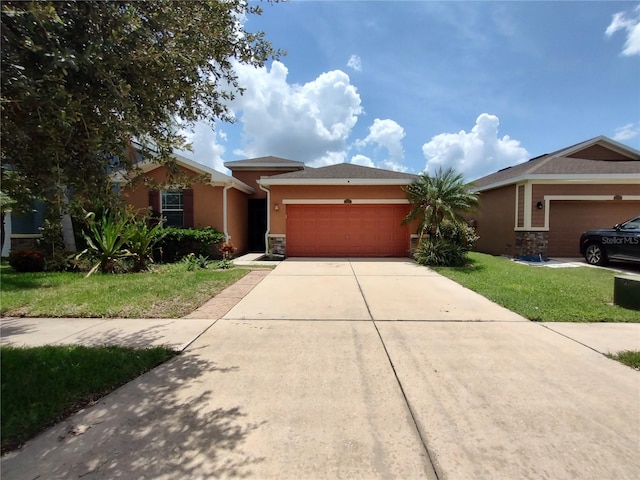 view of front of house featuring a front yard and a garage