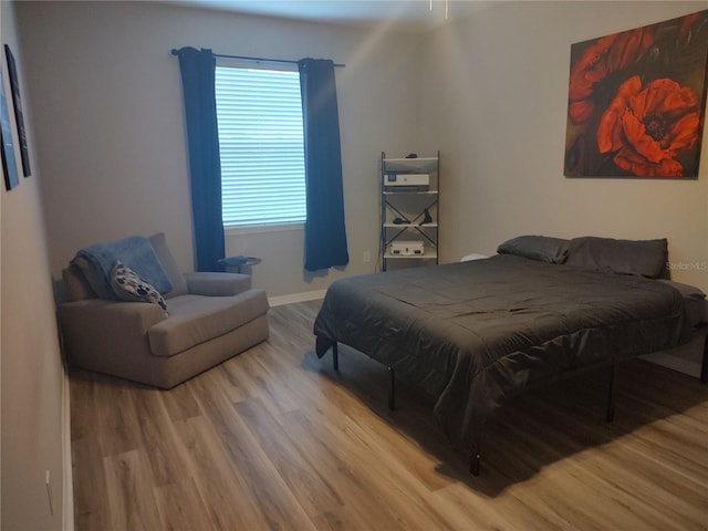 bedroom with light hardwood / wood-style flooring