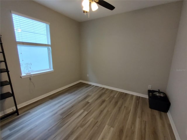 unfurnished room with hardwood / wood-style floors and ceiling fan