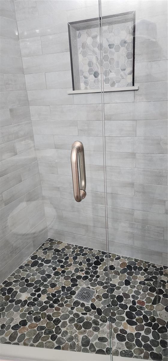 bathroom with walk in shower