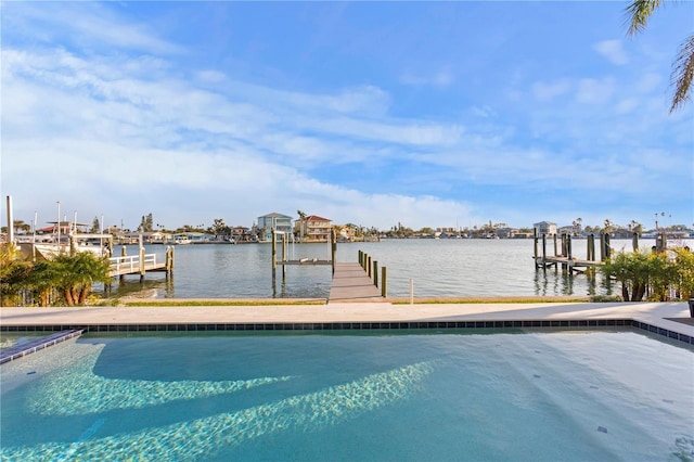 dock area with a water view and boat lift