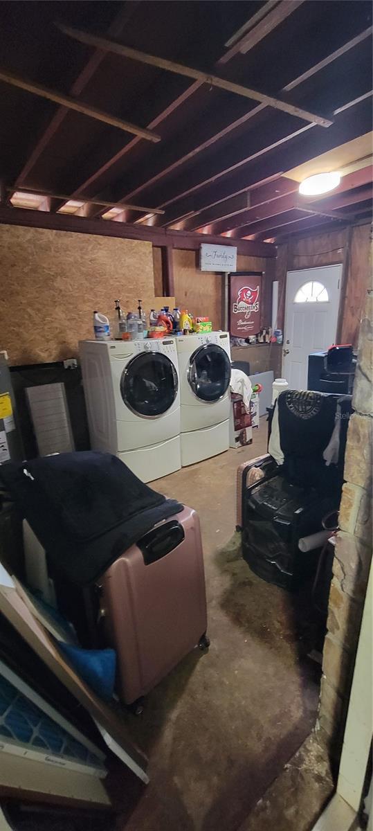 laundry room featuring washer and dryer and water heater