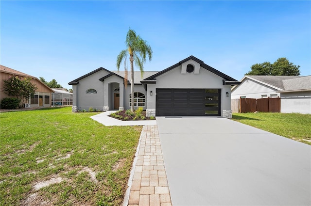 ranch-style house featuring a front lawn and a garage