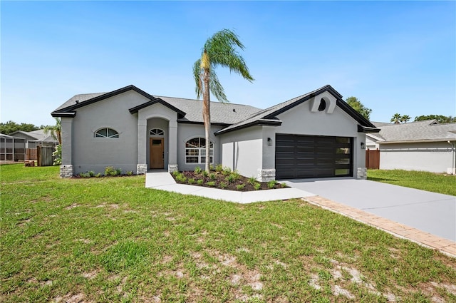 ranch-style home with a garage and a front lawn