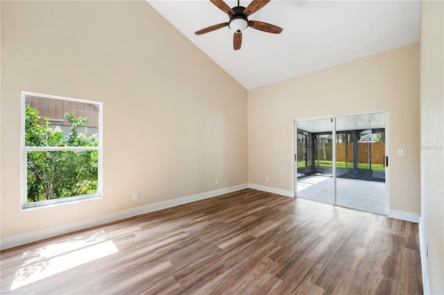 unfurnished room with ceiling fan, wood-type flooring, and high vaulted ceiling