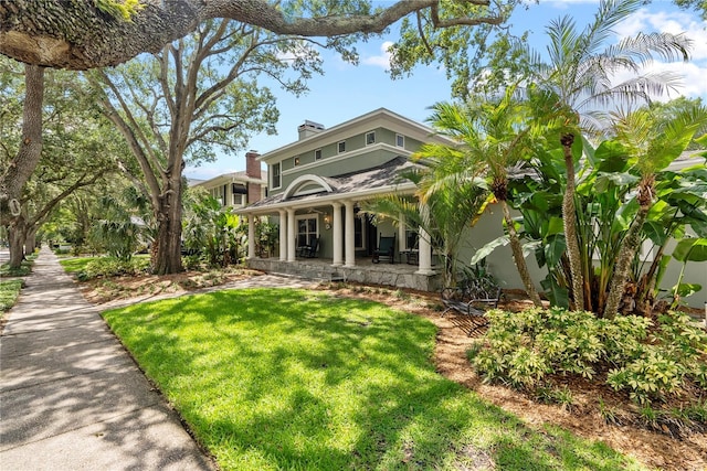 view of front of home featuring a front lawn and a porch