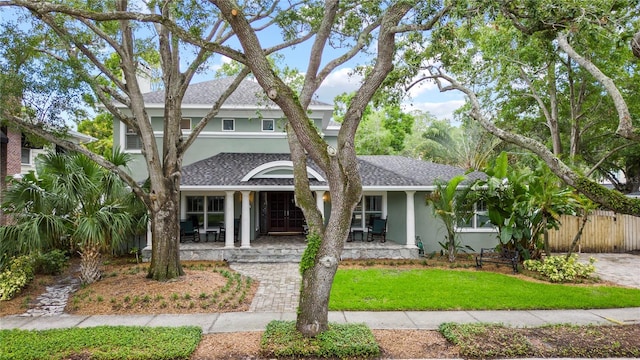 view of front of house featuring a front lawn and a porch