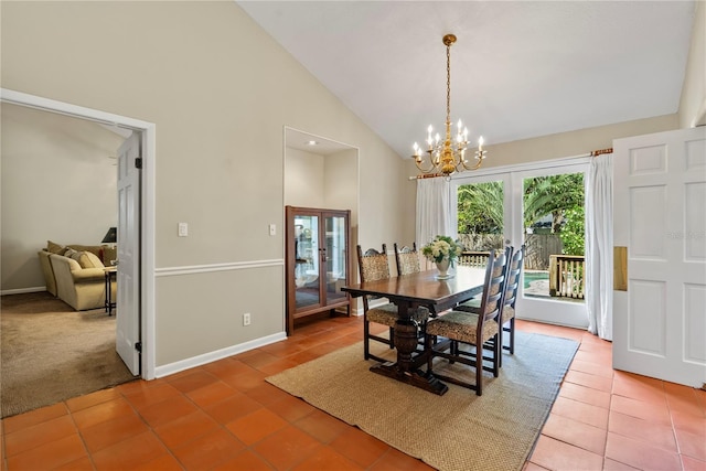 dining room featuring an inviting chandelier, tile patterned floors, high vaulted ceiling, and french doors