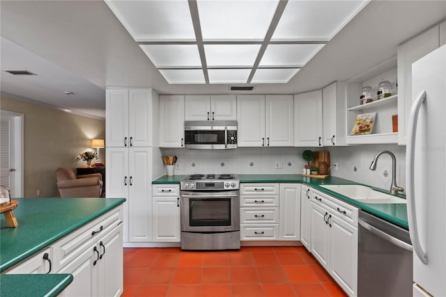 kitchen featuring white cabinetry, appliances with stainless steel finishes, and sink