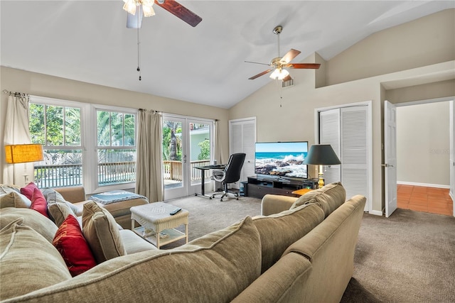 carpeted living room featuring ceiling fan and lofted ceiling