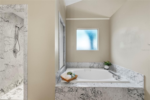 bathroom featuring plus walk in shower and lofted ceiling