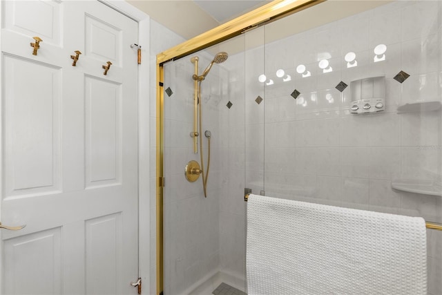 bathroom with a shower with shower door