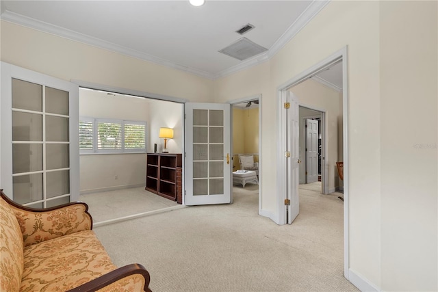 living area featuring french doors, ornamental molding, and carpet flooring