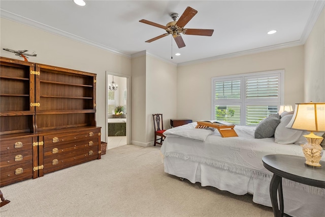 carpeted bedroom featuring ensuite bathroom, crown molding, and ceiling fan