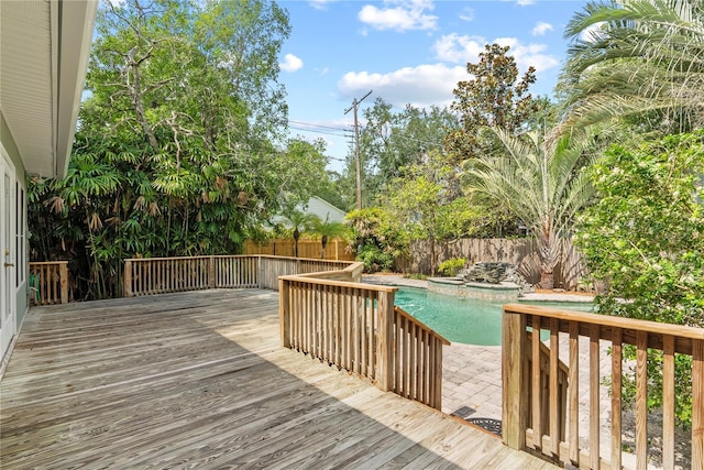 wooden terrace featuring a fenced in pool