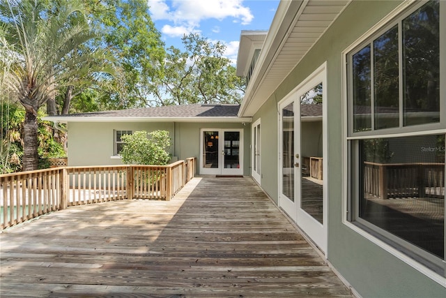 wooden deck featuring french doors