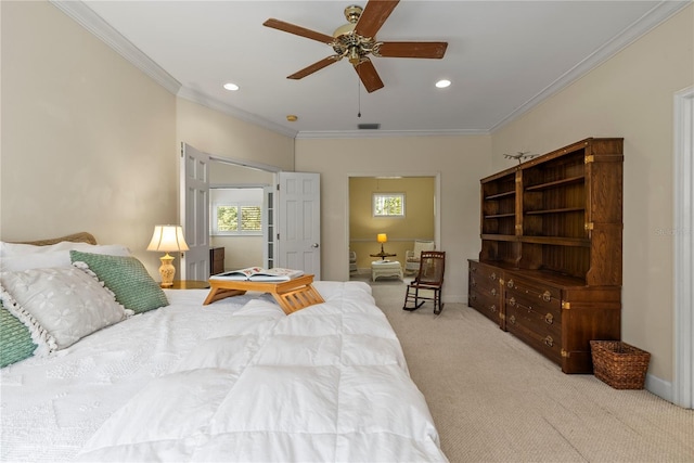 carpeted bedroom with multiple windows, ornamental molding, and ceiling fan