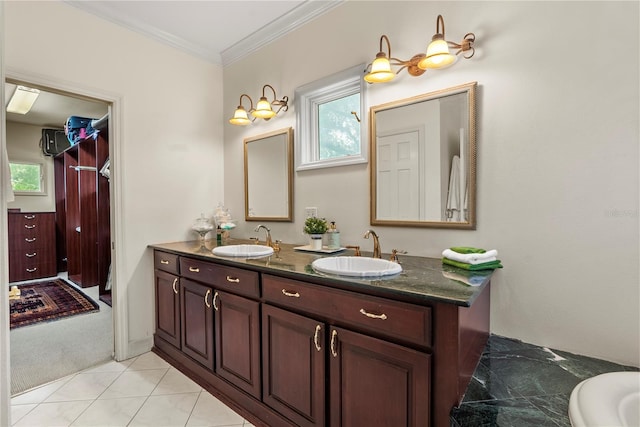 bathroom featuring ornamental molding, tile patterned flooring, and vanity