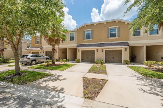 multi unit property featuring a garage