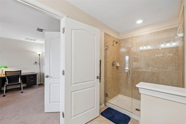 bathroom featuring a shower with door