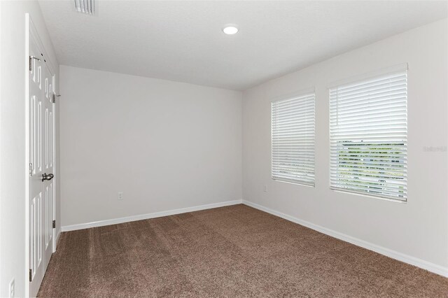 spare room featuring carpet flooring