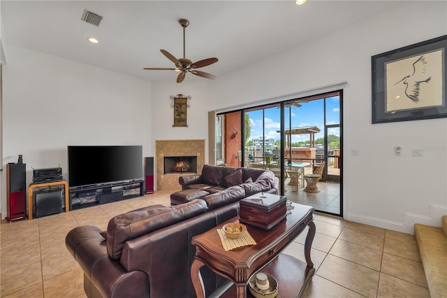 tiled living room with ceiling fan