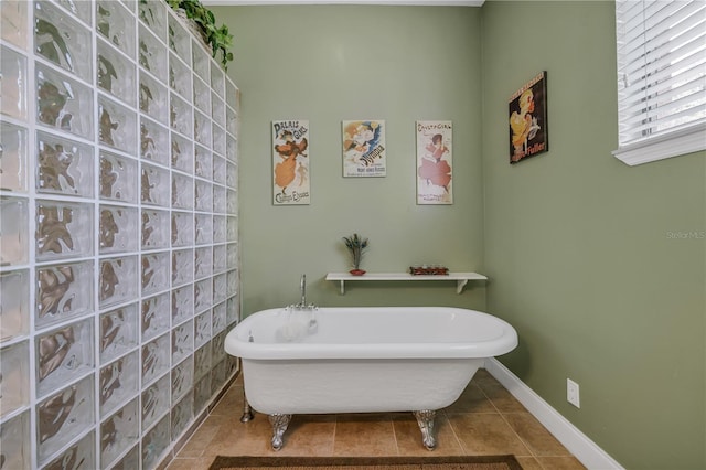 bathroom featuring tile patterned floors and a tub