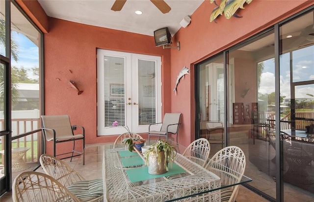 sunroom / solarium with french doors and ceiling fan