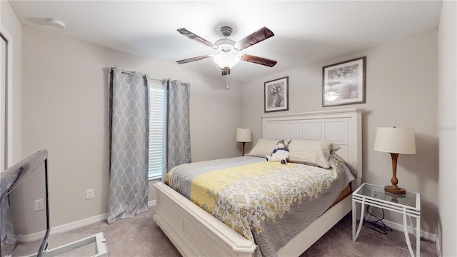 carpeted bedroom featuring ceiling fan