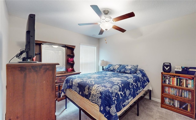 carpeted bedroom featuring ceiling fan