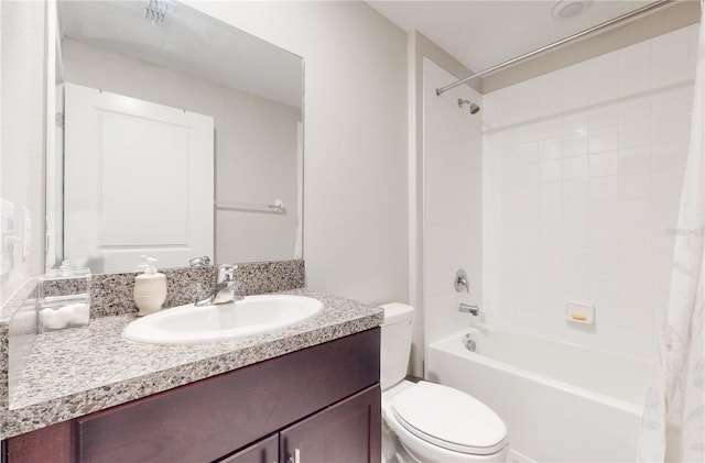 full bathroom featuring shower / tub combo with curtain, vanity, and toilet